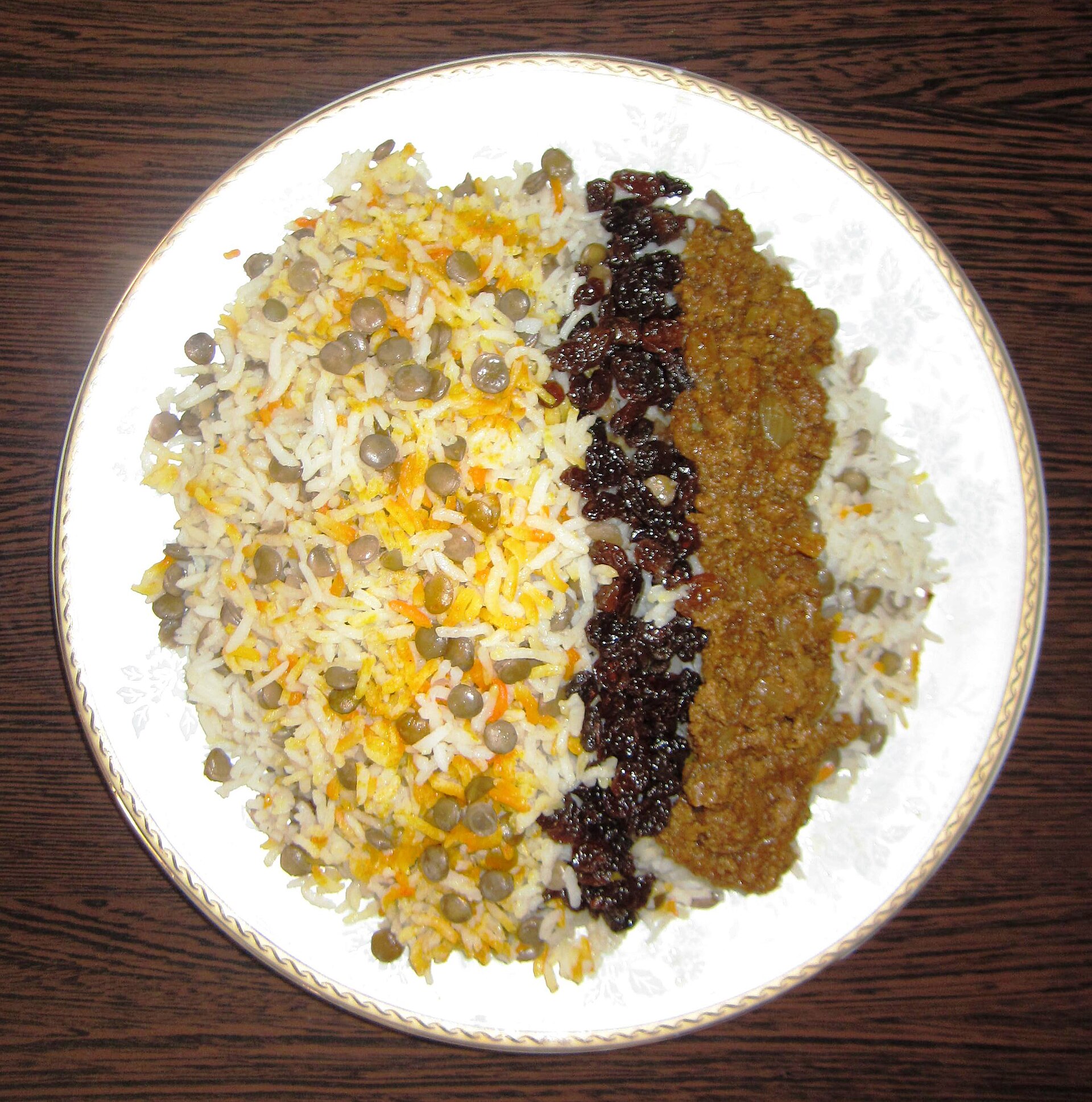 Plate of adas polo, Persian lentil rice with dates and raisins
