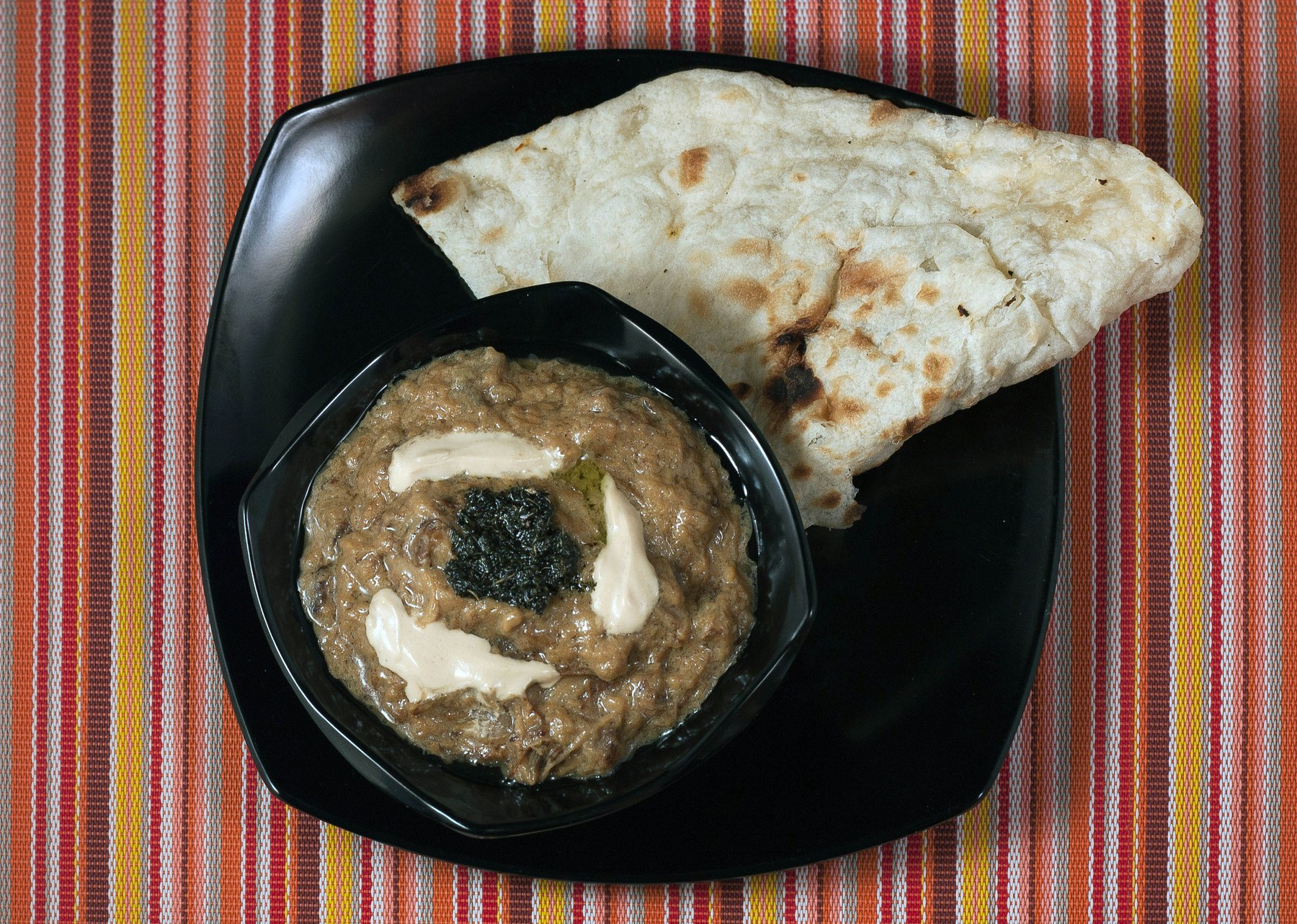 Kashk-e bademjan — Persian eggplant dip with kashk and fried mint.