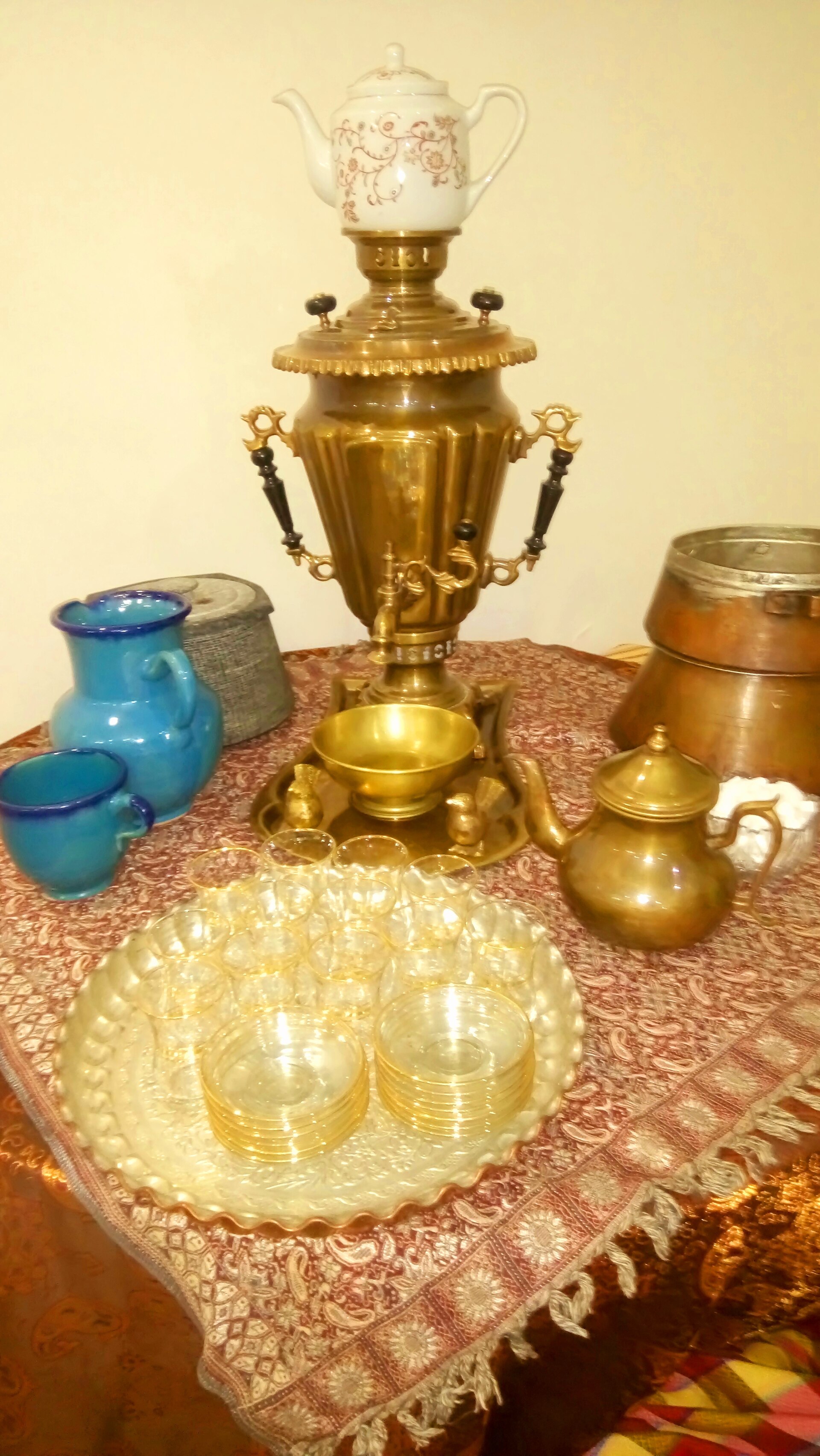 A charcoal samovar with a small teapot resting on top