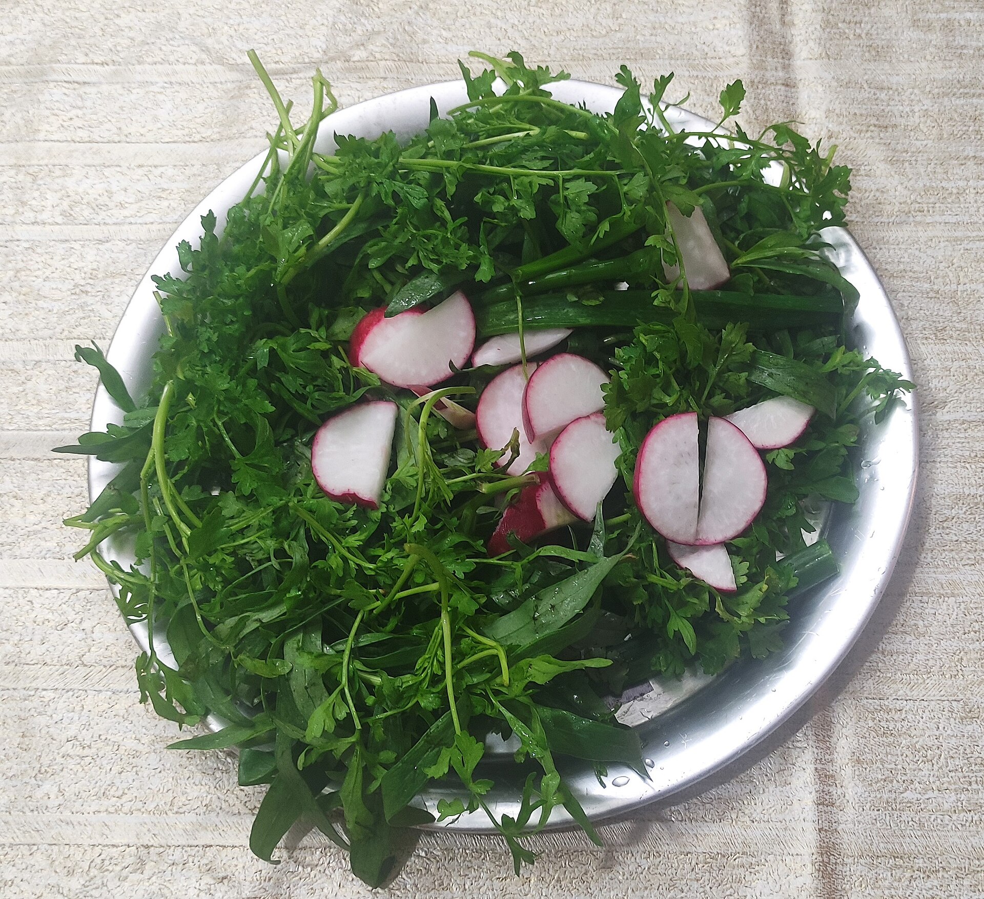 Platter of fresh Persian herbs with radish, served as sabzi khordan
